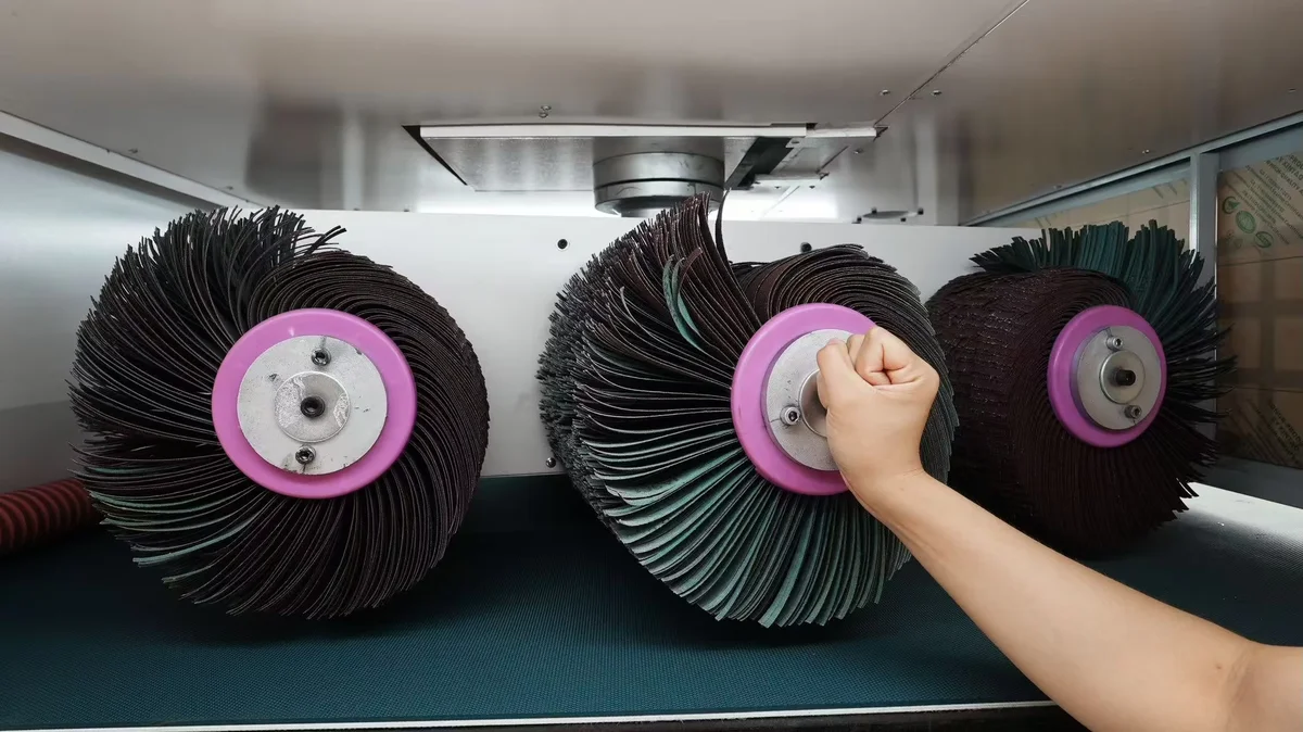Close-up of the universal chamfer wheel flap-wheel assembly on the MDC series machine